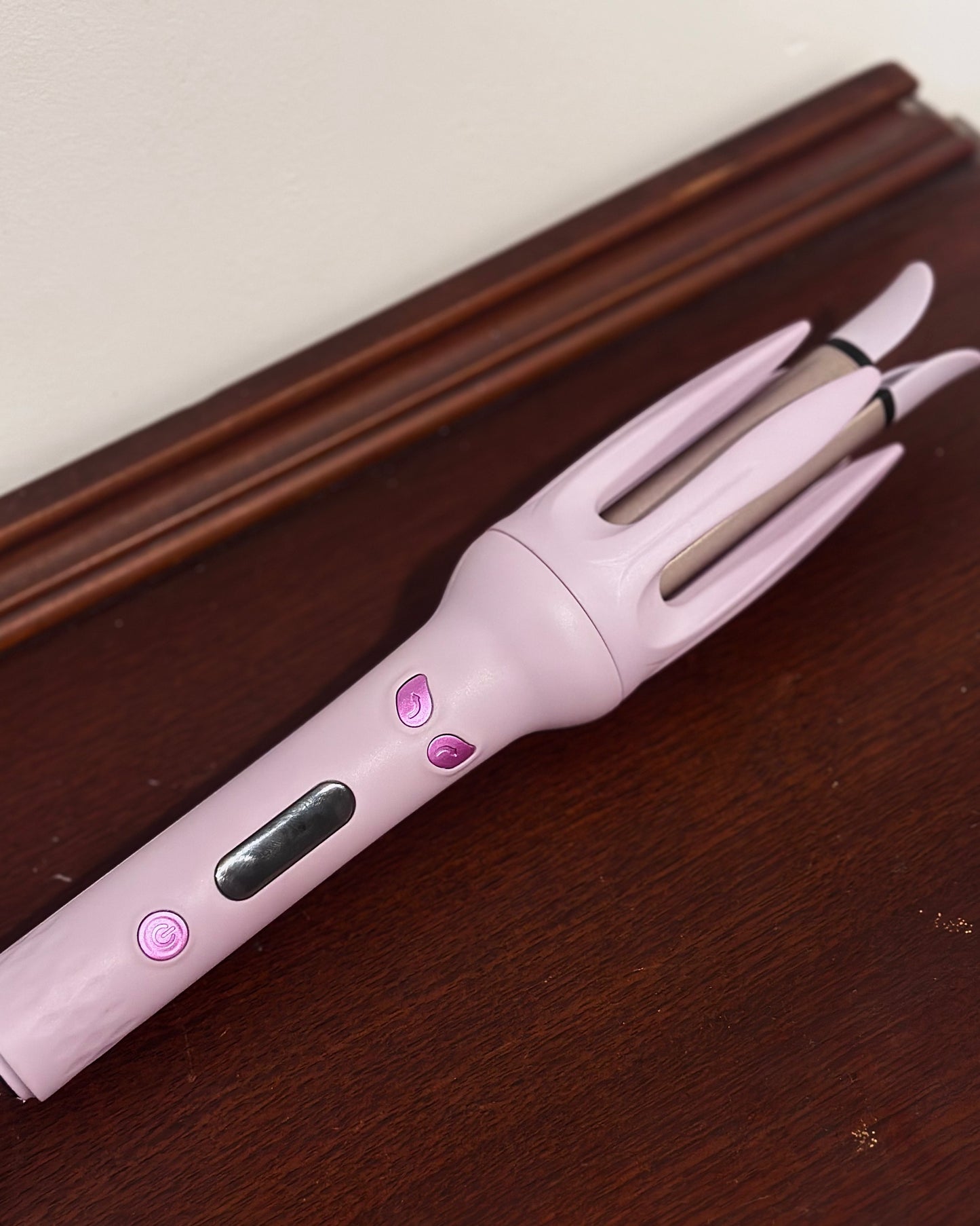Auto rotating curling iron in mauve purple