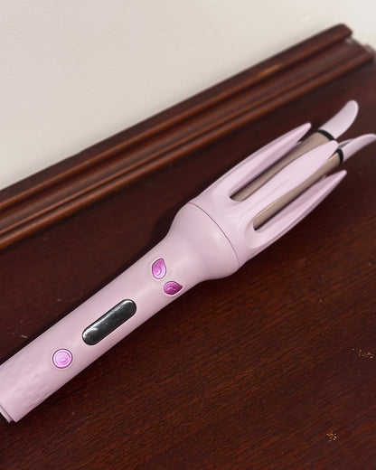 Auto rotating curling iron in mauve purple