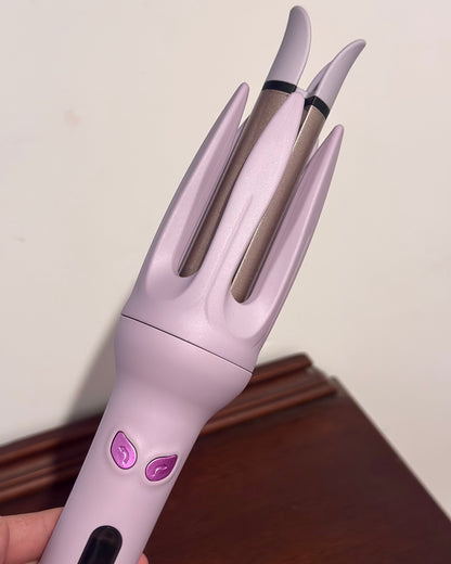 Auto rotating curling iron in mauve purple